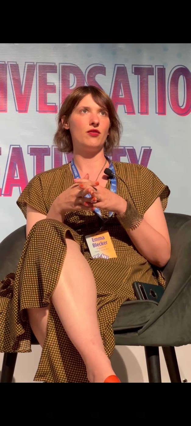 Emma on a panel, in conversation